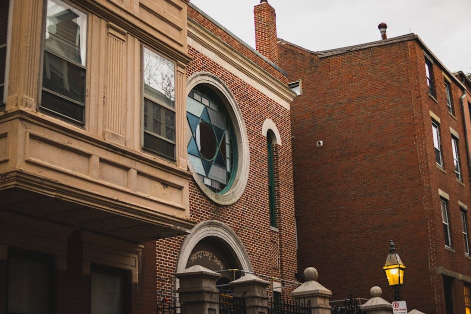 Photo of a historic synagogue with a Star of David stained glass window in Boston.