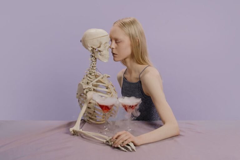 A whimsical Halloween-themed photo of a woman posing with a skeleton and cocktails.