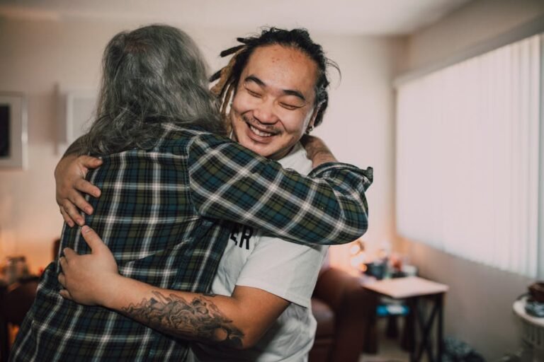 A joyful hug between friends in a cozy room, capturing warmth and friendship.